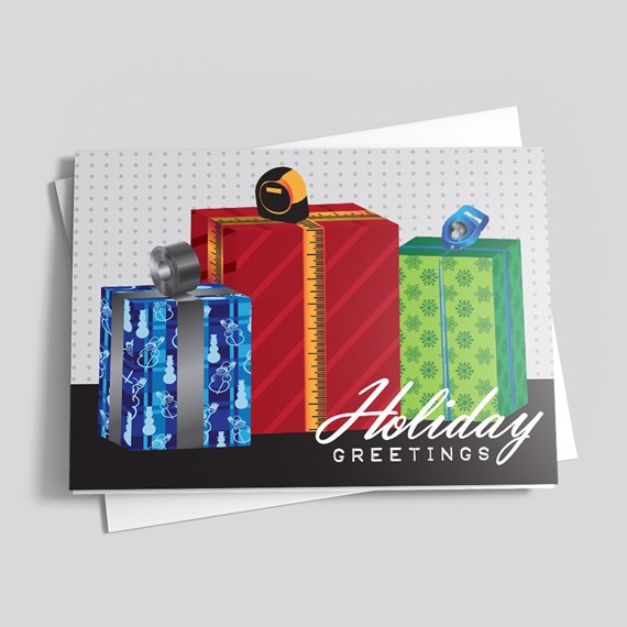 Folded holiday greeting card with three illustrated wrapped presents (blue, red, green) and 'Holiday Greetings' text on a dotted background