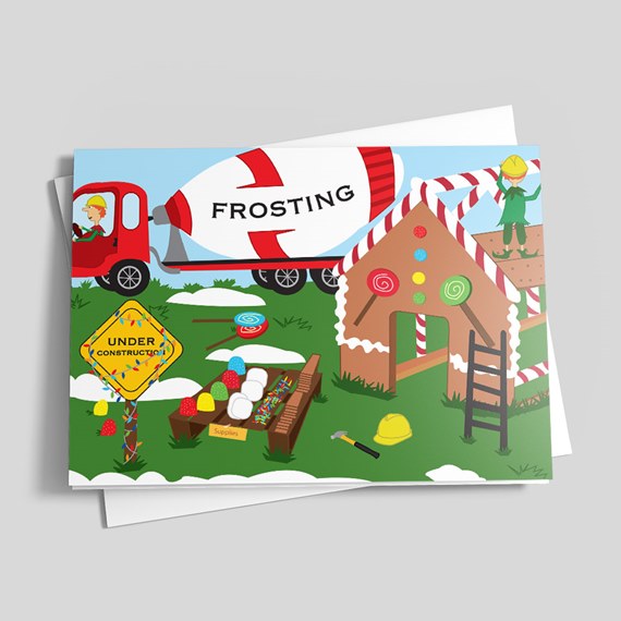 Greeting card illustration of a gingerbread house under construction with a frosting truck, candy decorations, construction sign, tools and elves.