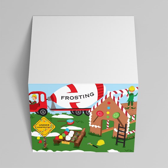 square gift box with gingerbread house construction illustration, frosting mixer truck, candy decorations and white lid