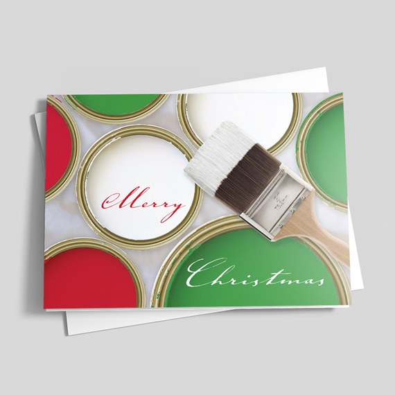 Folded Christmas greeting card with red, green and white paint cans and a paintbrush