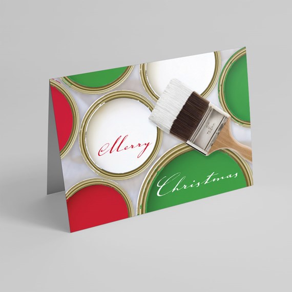 folded Christmas greeting card with paint cans, paintbrush and 'Merry Christmas' script