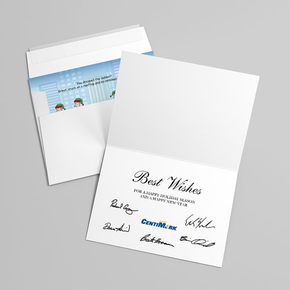 White folded greeting card reading 'Best Wishes' with printed signatures and small blue logo, paired with a white envelope showing a blue illustrated liner.