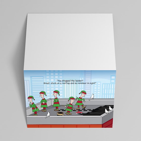 Folded holiday greeting card with cartoon elves on a rooftop and city skyline on white card stock