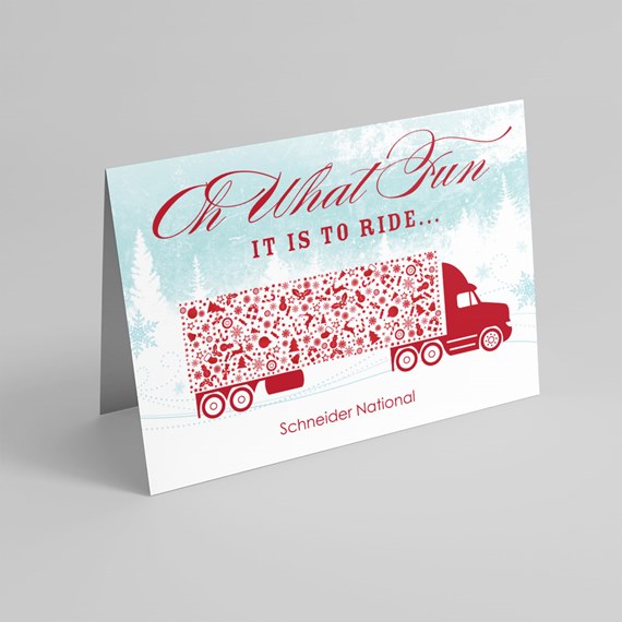 Folded holiday greeting card with red semi truck and patterned trailer on a teal winter background reading "Oh What Fun it is to ride..."