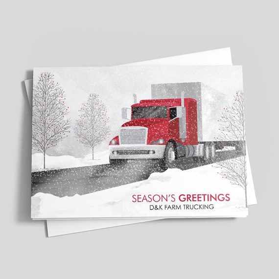 Holiday greeting card with red semi truck on a snowy road and bare winter trees