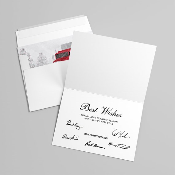 Folded holiday greeting card reading "Best Wishes" with signatures, paired with an envelope showing a snowy scene and a red truck liner.