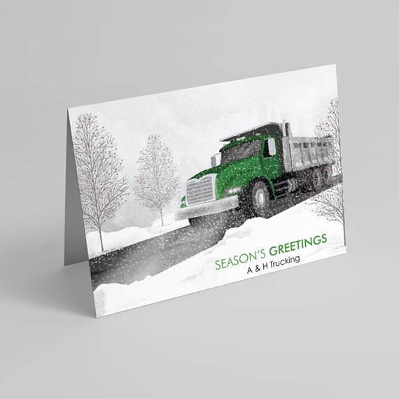 truck driving on snowy road with trees and text