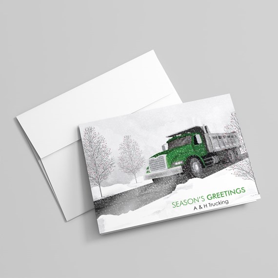 green truck in snowy landscape with trees and text