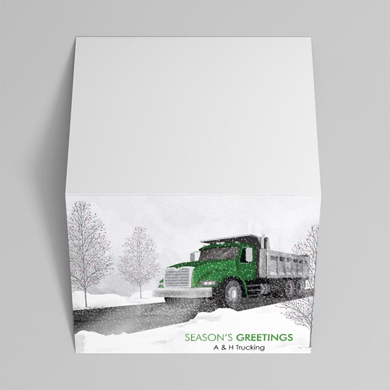 green truck on snowy road with trees, text placeholder