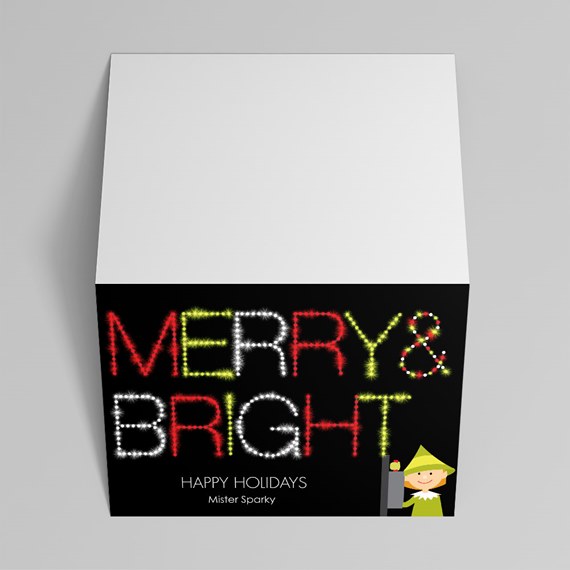 square holiday gift box with white lid and black front panel reading 