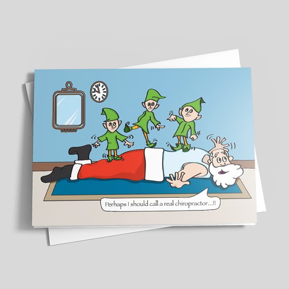 Christmas greeting card showing cartoon Santa face down with three elves jumping on his back and a caption about calling a chiropractor