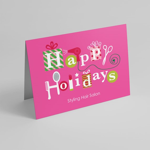 Pink folded holiday greeting card with salon-themed icons and happy holidays text