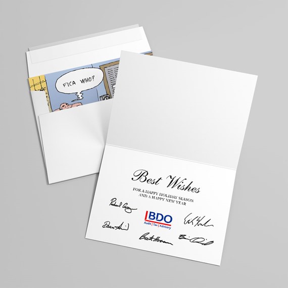 white folded holiday greeting card open to show 'Best Wishes' message, printed signatures and a cartoon insert inside a white envelope