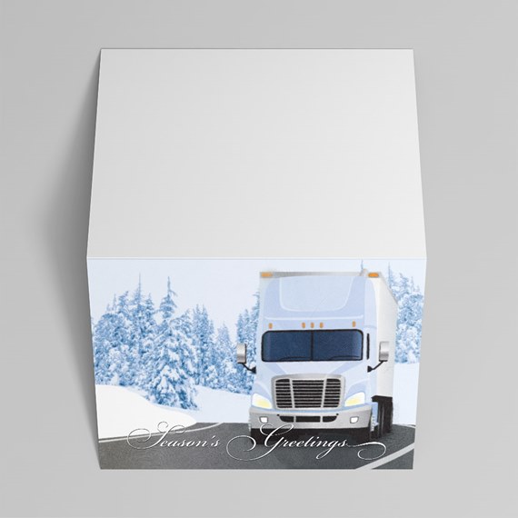 Square gift box with illustration of a white semi truck on a snowy road and "Season's Greetings" text