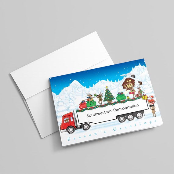 holiday greeting card with a red semi-truck hauling gifts, reindeer and a Christmas tree in a snowy mountain scene