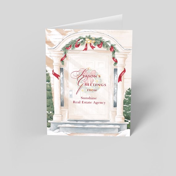 Folded holiday card with watercolor front-door illustration, evergreen garland, red ribbons and snowy steps