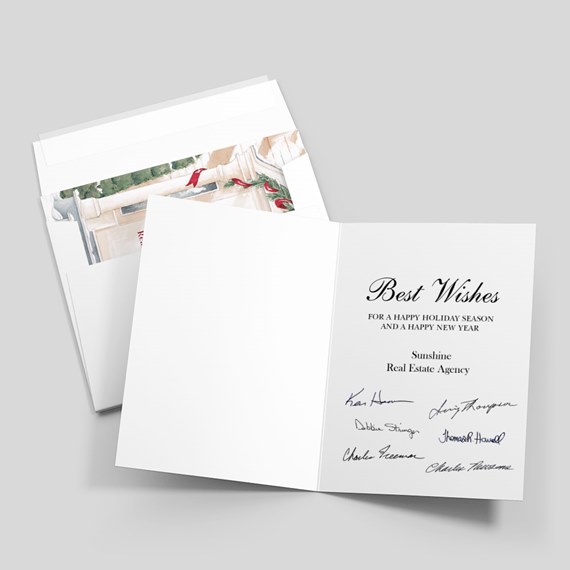 Open folded holiday greeting card with printed Best Wishes message, multiple signatures and matching envelope with decorative liner