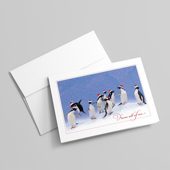 penguins wearing Santa hats, snowy background, text area