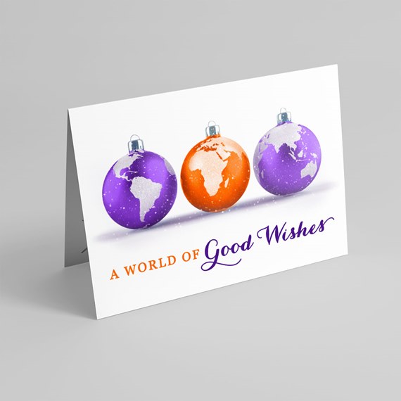 three ornaments with world maps, text area